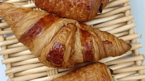 Croissant and chocolate bread, close-up, on a table Stock Footage 271571471