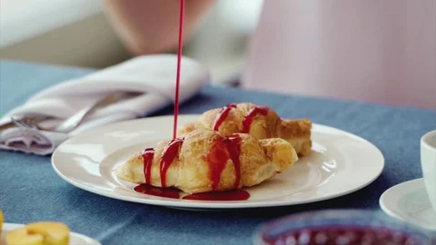 Croissant and jam in slow motion Stock Footage 73605335