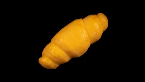 Croissant baking and rising, timelapse, isolated on black background Stock Footage 105395016