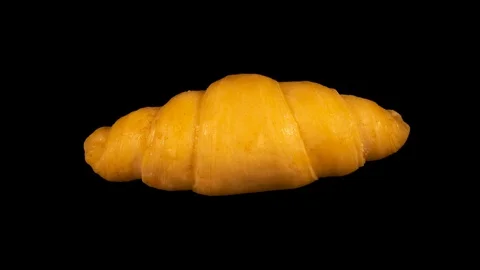 Croissant baking in oven, timelapse, isolated on black background Stock Footage 105394967