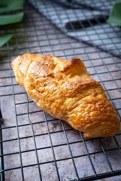 Croissant on baking rack Stock Photos