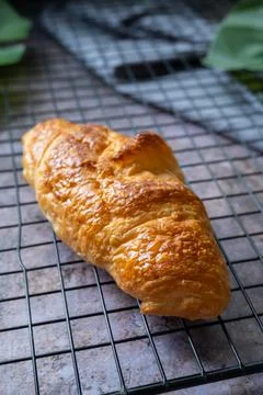Croissant on baking rack Stock Photos