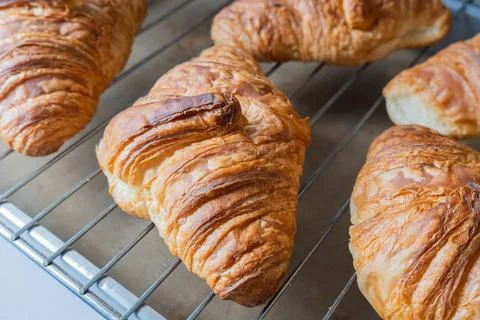 Croissant on baking rack Stock Photos