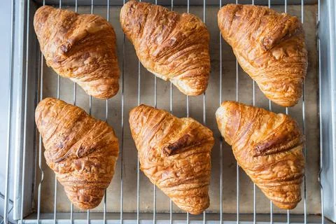 Croissant on baking rack Stock Photos