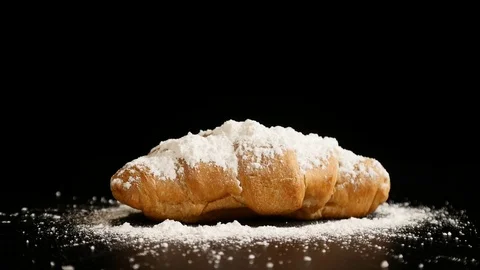 Croissant on a black background. close up Video stock 85220830