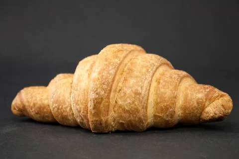 Croissant on a black background Stock Photos