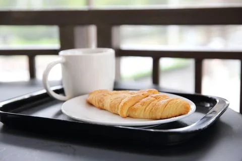 Croissant with coffee Stock Photos