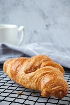 Croissant with a cup of coffee Stock Photos