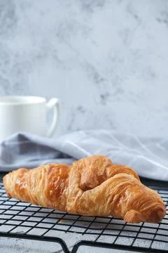 Croissant with a cup of coffee Stock Photos