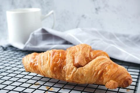 Croissant with a cup of coffee Stock Photos