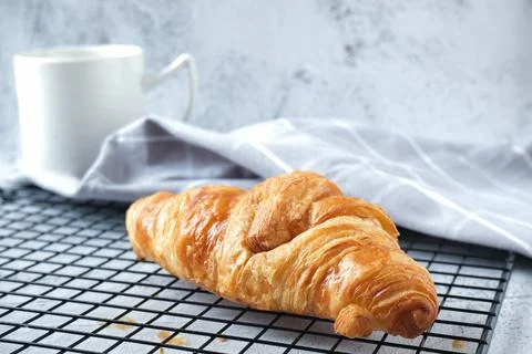 Croissant with a cup of coffee Stock Photos