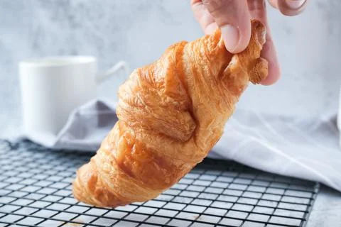 Croissant with a cup of coffee Stock Photos