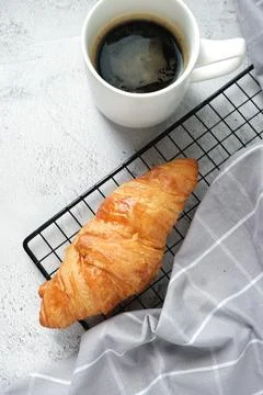 Croissant with a cup of coffee Stock Photos