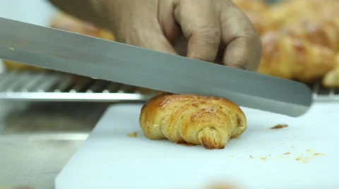 Croissant cutting. Stock Footage 34678473