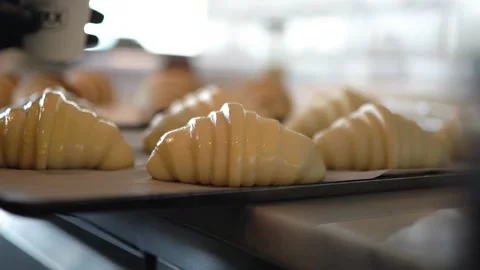 Croissant dough is prepared with eggs before going into the oven. Video stock 180992275