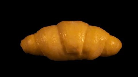 Croissant isolated on black background, baking timelapse Stock Footage 105394920