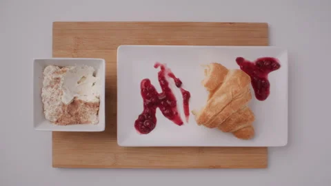 Croissant on a Plate in Stop Motion Stock Footage 255675550