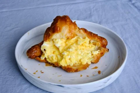 Croissant with scrambled eggs Stock Photos
