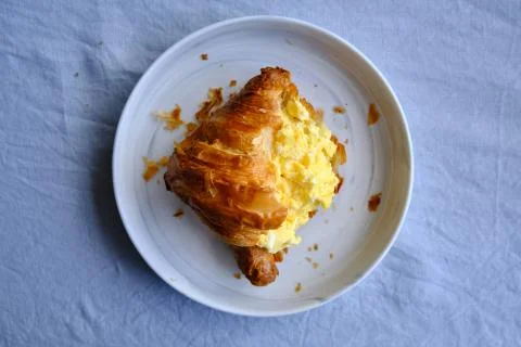 Croissant with scrambled eggs Stock Photos