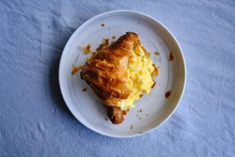 Croissant with scrambled eggs Stock Photos