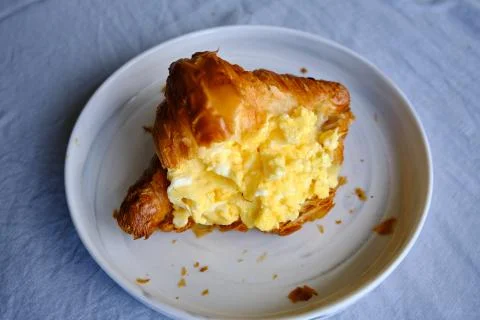 Croissant with scrambled eggs Stock Photos