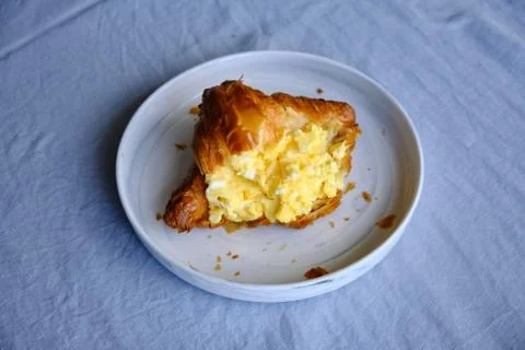 Croissant with scrambled eggs Stock Photos