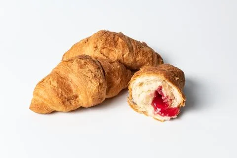 Croissant with stuffing on a white background Stock Photos