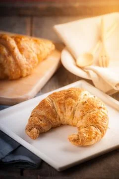 Croissant on wood table Stock Photos