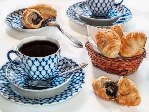 Croissants in a basket on a table Stock Photos