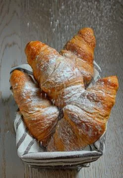 Croissants in a basket on table Free Stock Photos