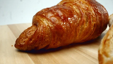 Croissants powdered sugar on the table, white background Stock Footage 107772669