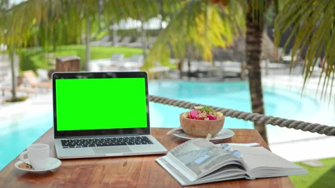 Croma key computer closeup. Green screen backdrop. Macbook laptop palm tree cafe Stock Footage 246407423