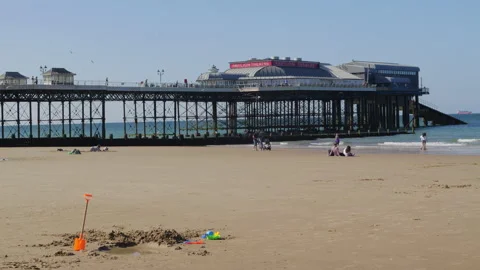 Cromer Pier and beach scene Stock Footage 313409767