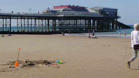 Cromer Pier and beach scene Stock Footage 313409799