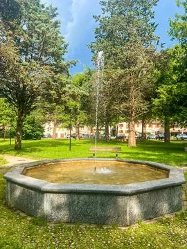 Crone public park with empty bench on Lake Idro, Lombardy, Italy. Stock Photos