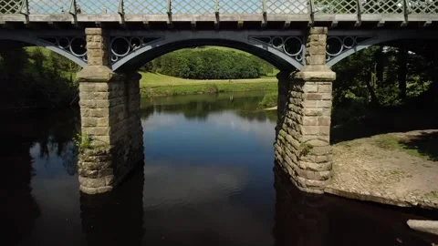Crook O Lune, river, England. Camera flies beneath bridge. Stock Footage 159706486