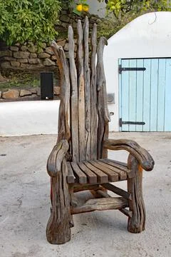 Crooked old wooden chair at the Eden Project in Cornwall, England Stock Photos