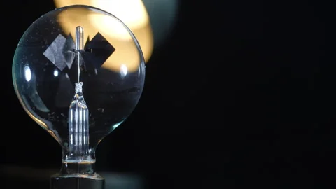 Crookes Radiometer Light Mill - Backlit on Black - Left Aligned with Copy Space Stock Footage 331101019