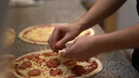 Crop anonymous cook preparing pizza in restaurant kitchen Stock Footage 238814001