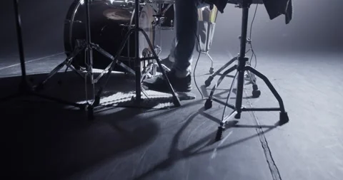 Crop anonymous man pushing drum pedals during rock concert Video stock 249852116