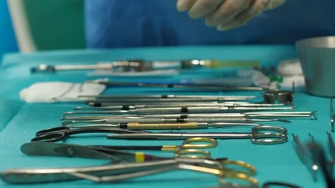 Crop assistant surgeon arranging tools on table Stock Footage 269340987