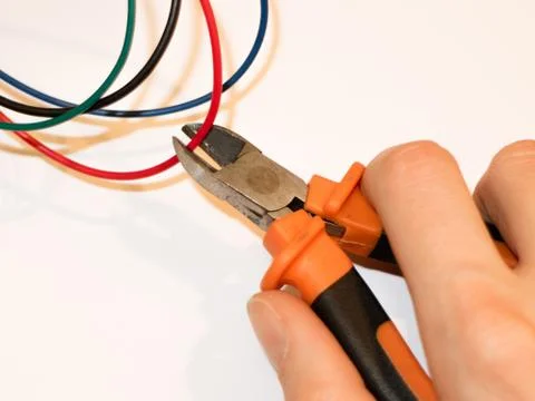 Crop the cable, the right choice. What should be cut off? Red, blue or green? Stock Photos