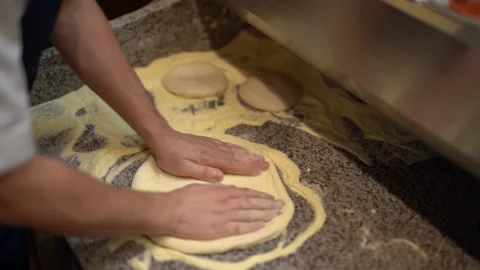 Crop chef kneading dough while making pizza in kitchen Stock Footage 238813977