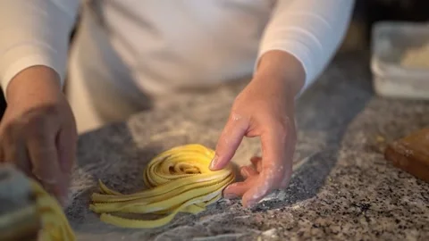 Crop chef making noodle rolls in restaurant Stock Footage 239611094