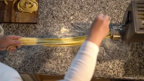 Crop chef making noodles with machine Stock Footage 239611123