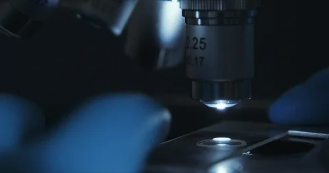 Crop closeup shot of microscope in the laboratory, scientist is conducting study 库存影片 125771083