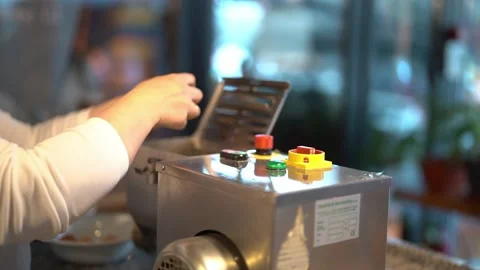 Crop cook breaking and adding eggs into dough maker Stock Footage 239512683