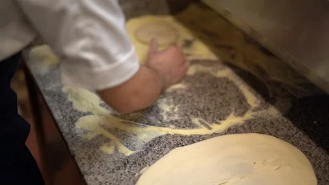 Crop cook preparing and kneading dough for pizza in kitchen Stock Footage 240312741