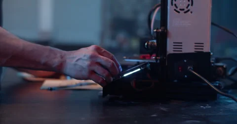 Crop craftsman operating modern 3D printer in laboratory Video stock 259390038