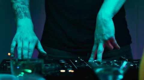 Crop DJ playing music during party Stock Photos
